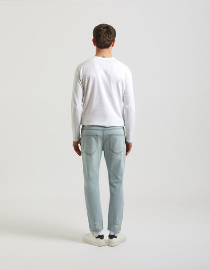 Jeans regular fit con strappi