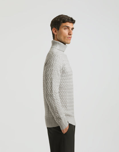 Maglia collo alto con treccia