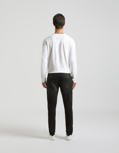 Jeans skinny fit con strappi nero